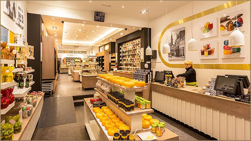 Image of an apartment complex with cars parked in front